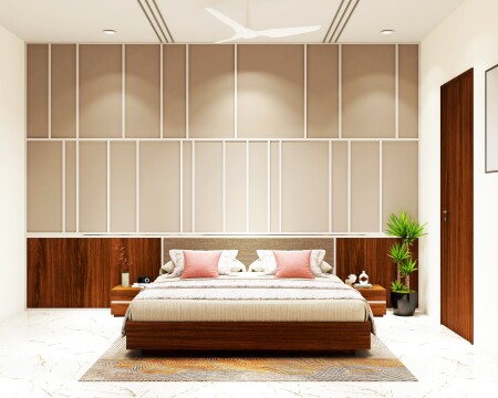 Beige and brown contemporary bedroom with a geometric accent wall, upholstered headboard, side tables with drawers, pendant lights, and a large mirror