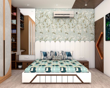 Floral wallpaper bedroom with white and blue decor, comfortable bed, built-in wardrobe, and cozy reading nook